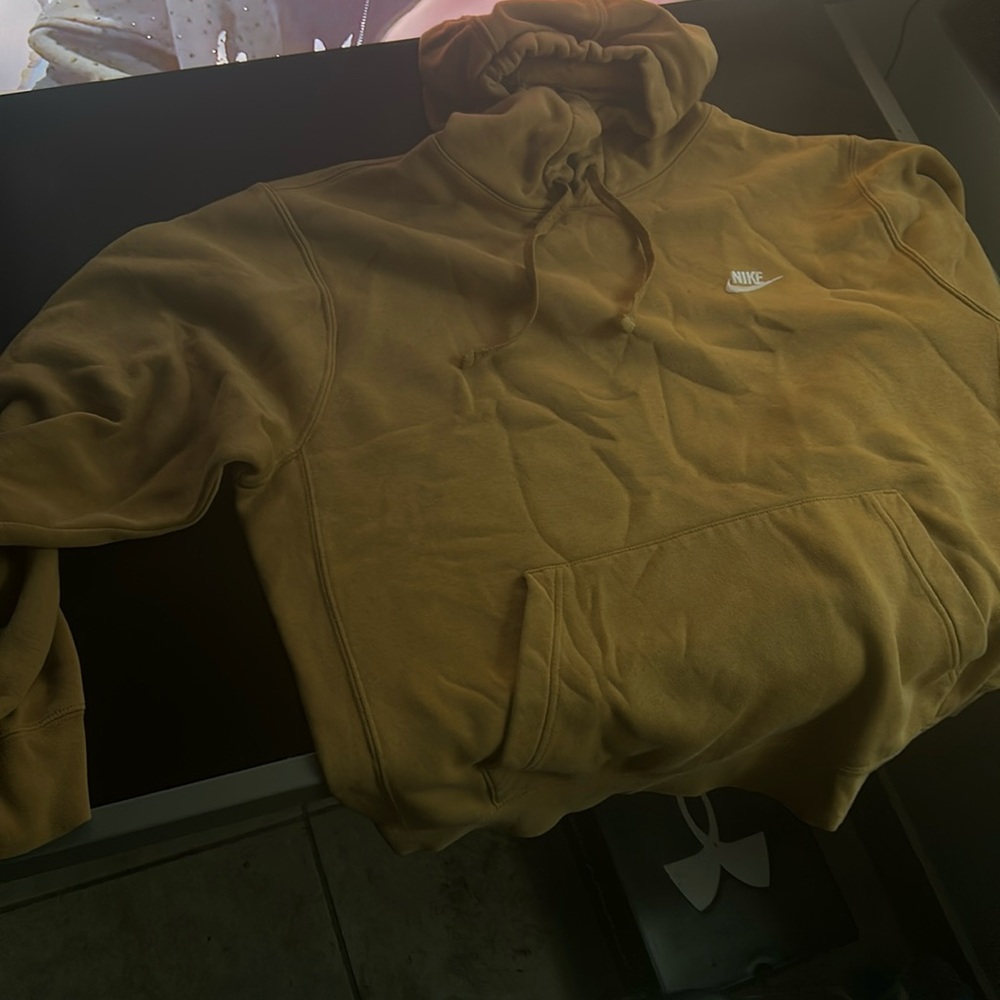 A large tan Nike hoodie 
Fairly new and only worn twice